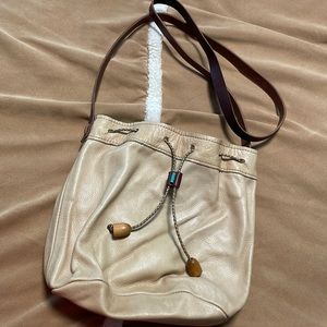 Leather purse with turquoise bead on leather toggle